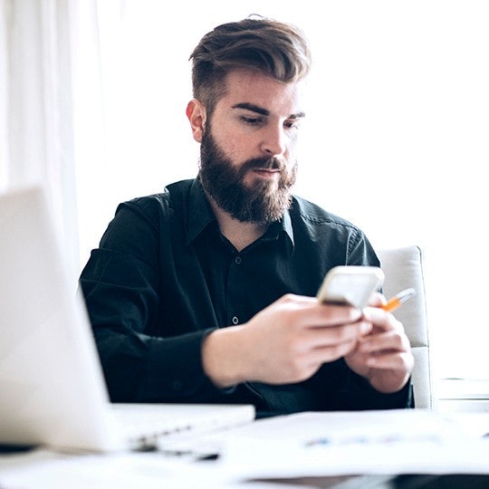 man looking into his phone