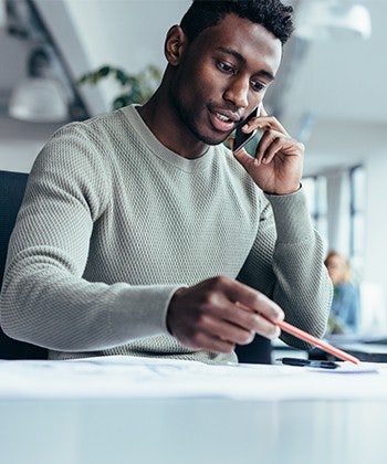 man speaking to a smartphone