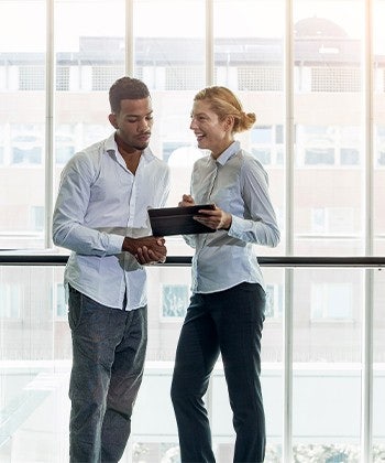 people discussing with tablet