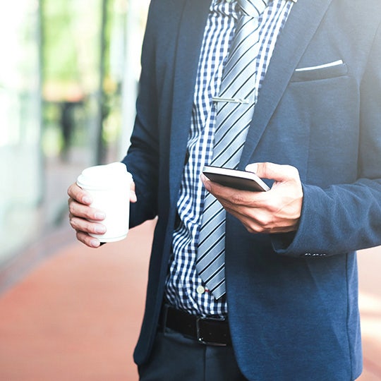 man looking into his phone