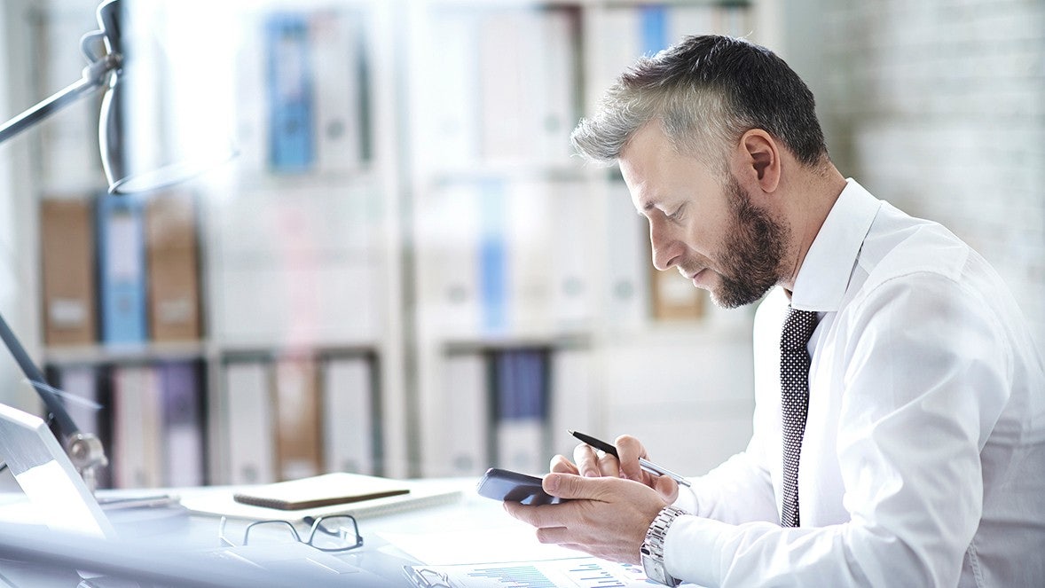man working with his phone