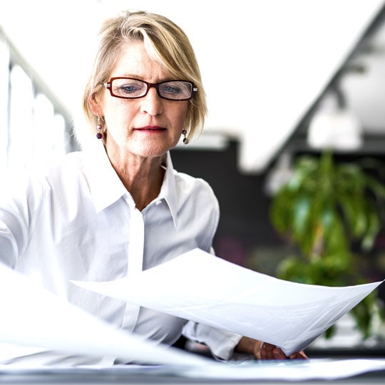 woman looking into some papers