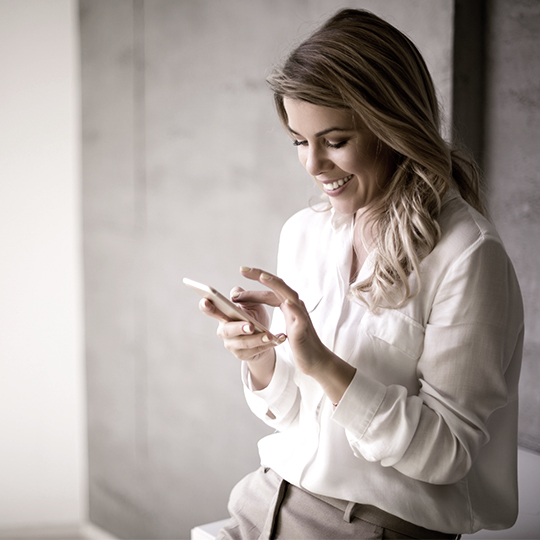 woman looking to her phone