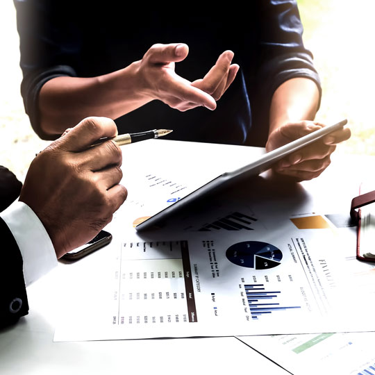 people looking into a tablet