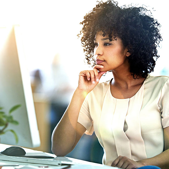 woman working on a desktop computer