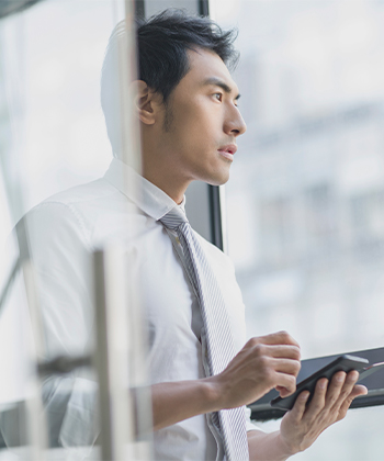man looking through a window