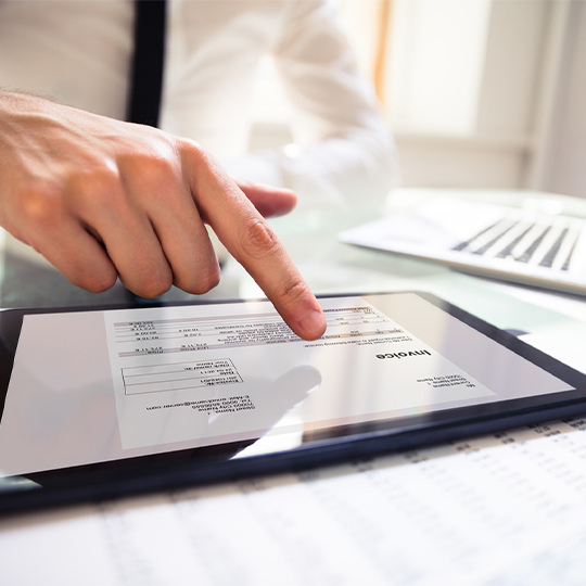 finger touching tablet screen