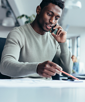 man speaking to a smartphone