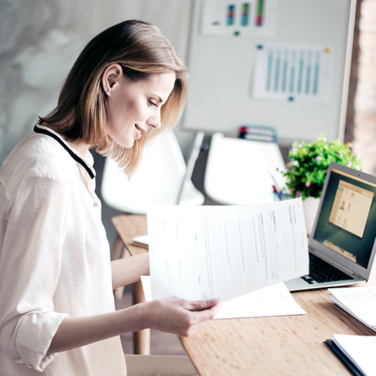 woman looking into some papers