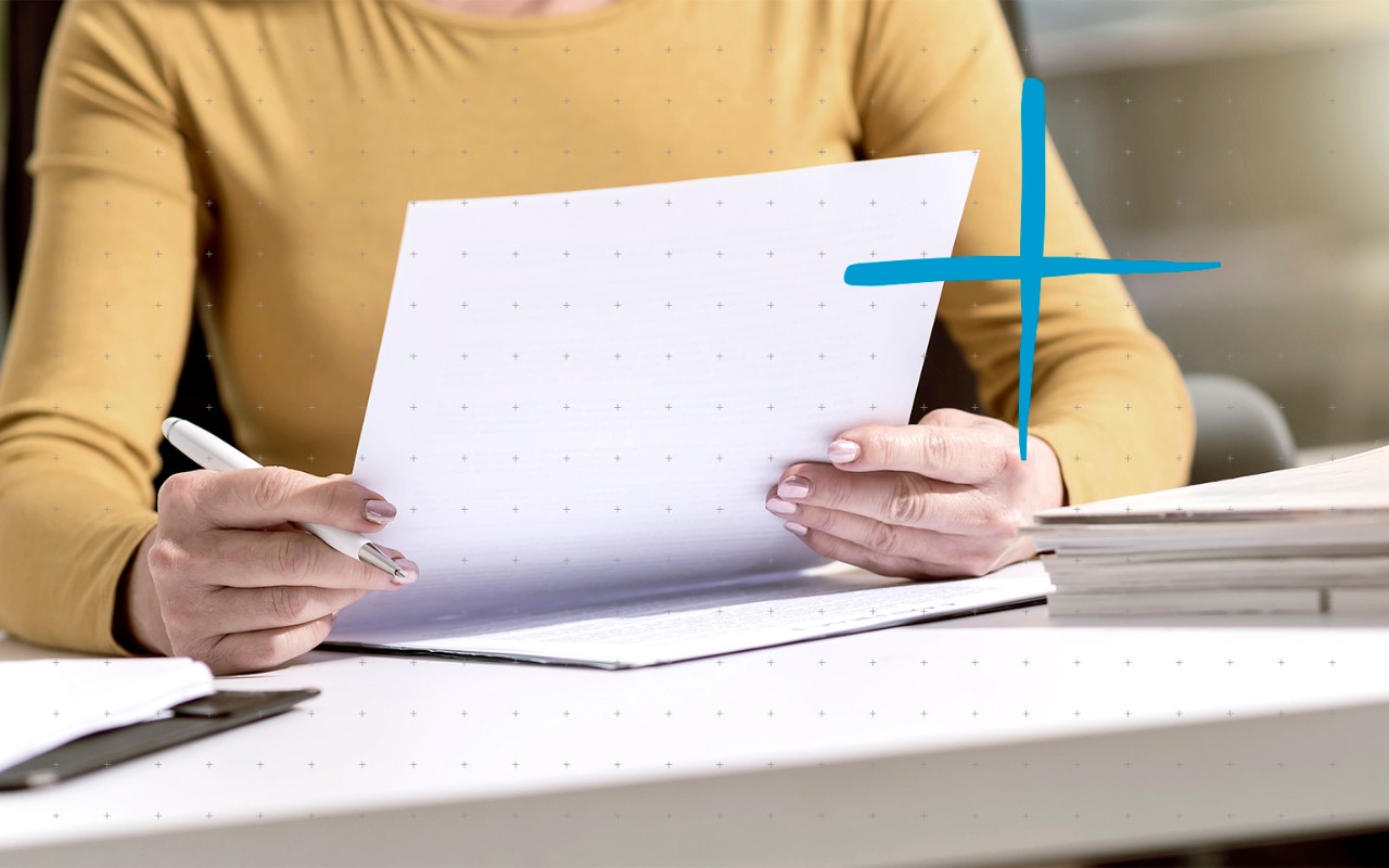 woman holding a paper