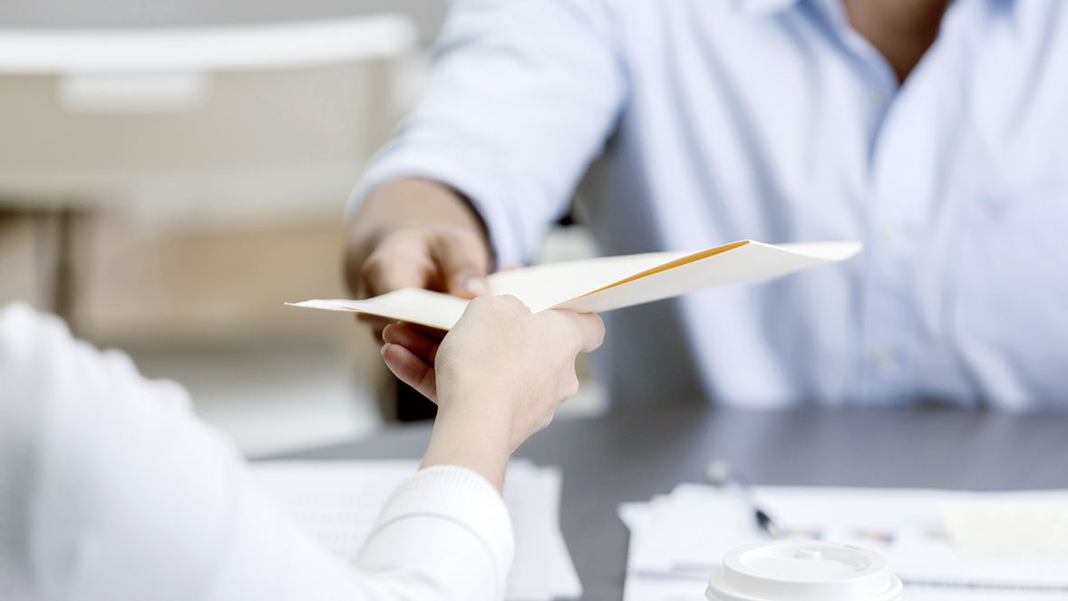 hands sharing a paper
