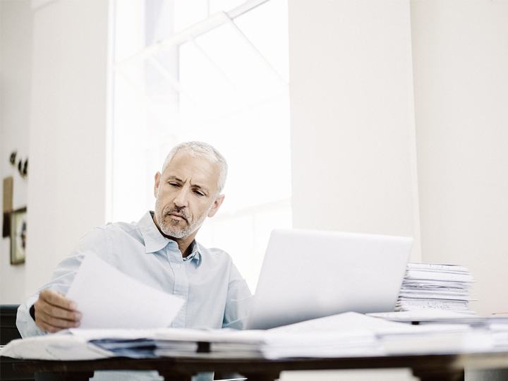 Introducing KSIM man looking into papers
