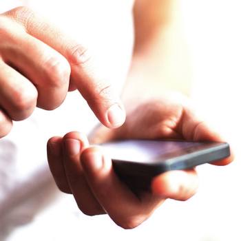 KFS Privacy Statement Close up of hands typing on a smartphone