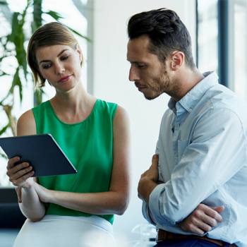 Kyocera’s new smart information management system people looking into a tablet