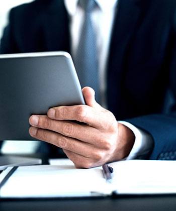 man holding his tablet