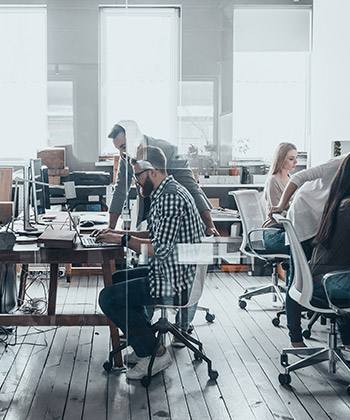 Our beginnings were humble employees working in a glass office