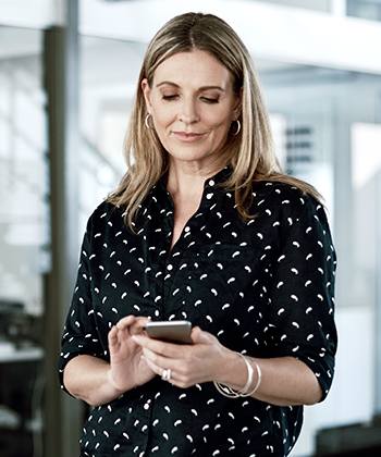 woman holding her phone