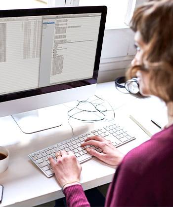 woman typing in a computer