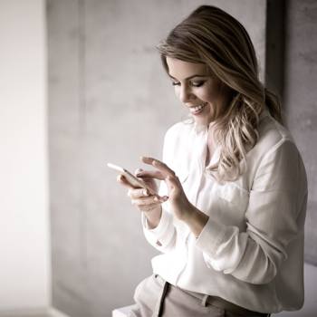 woman looking into her mobile