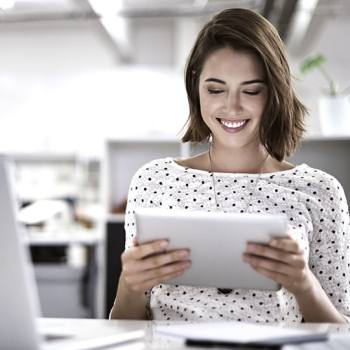 Stay productive! woman looking into a tablet