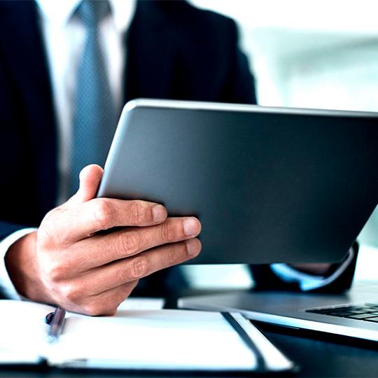 Check out our HyPAS-enabled MFP devices man looking into a tablet