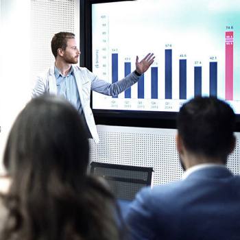 The new business models of digital platforms man presenting numbers